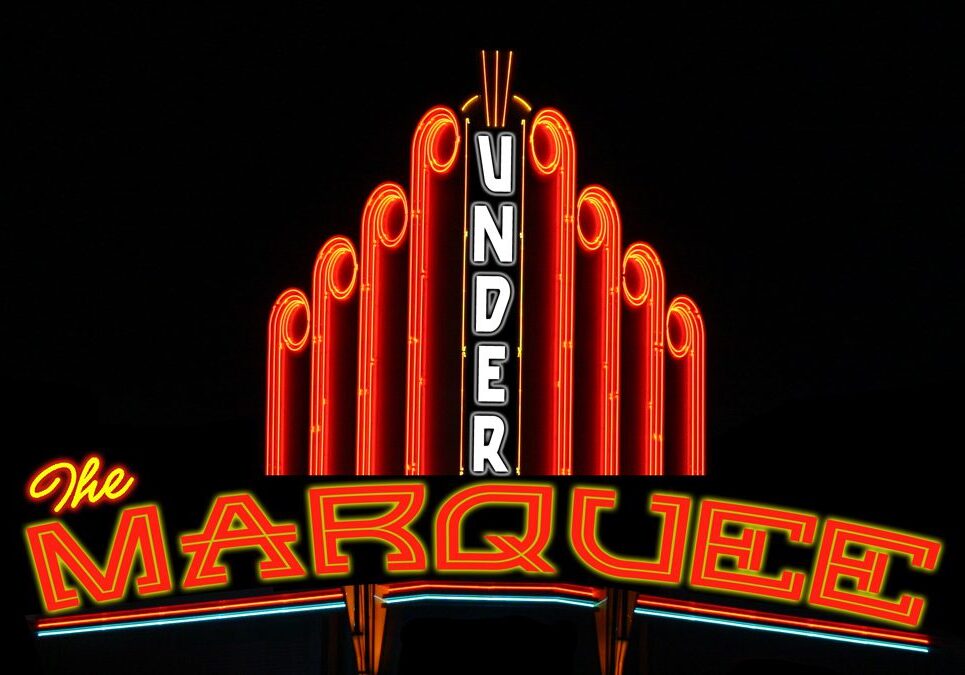 Neon sign reading "The Marquee Under".