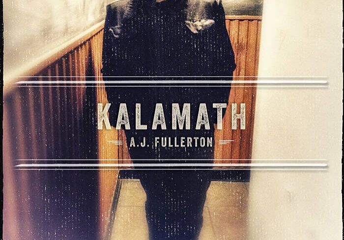 Man standing with "Kalamath" text overlay.