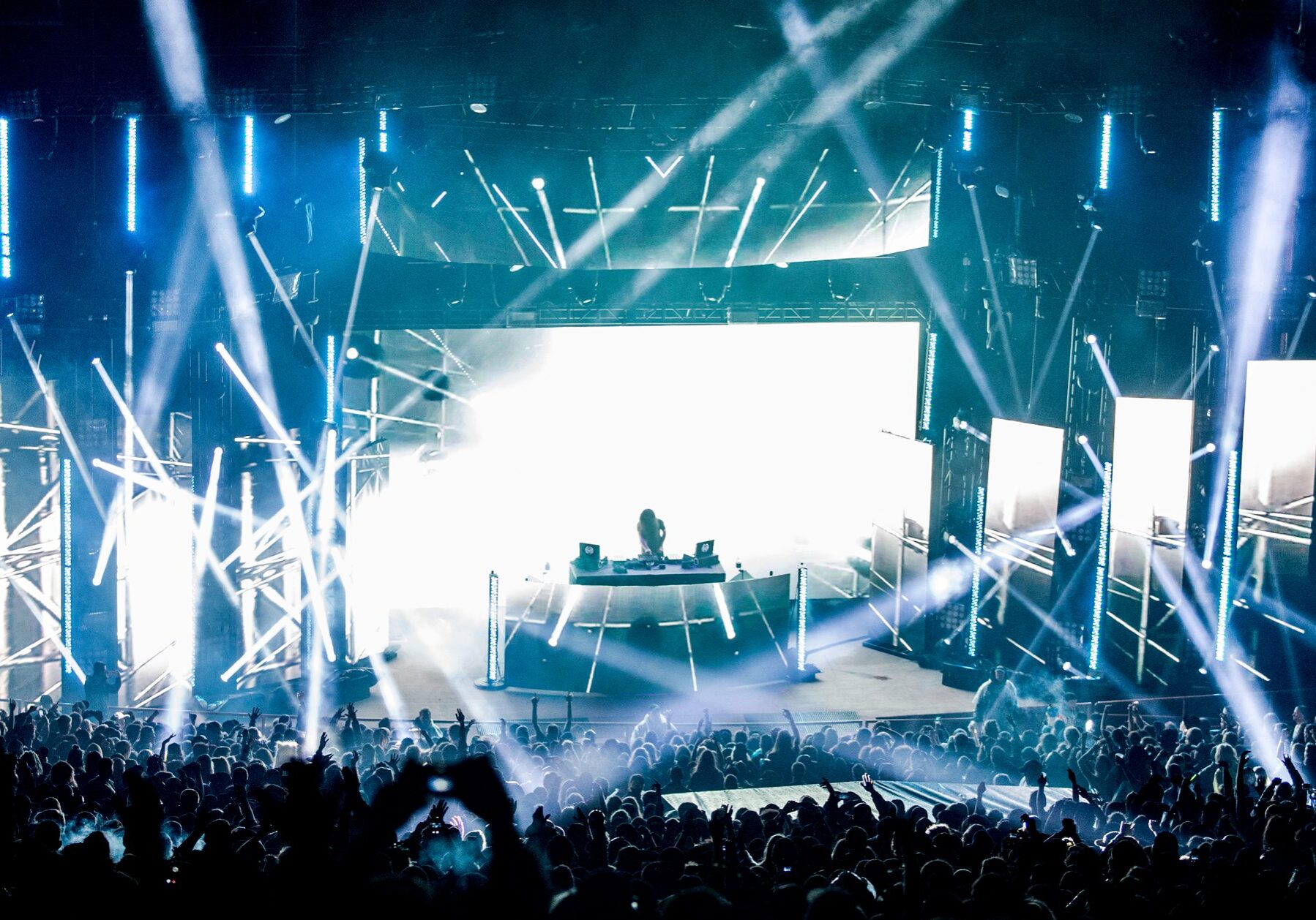DJ performing at a vibrant music festival.
