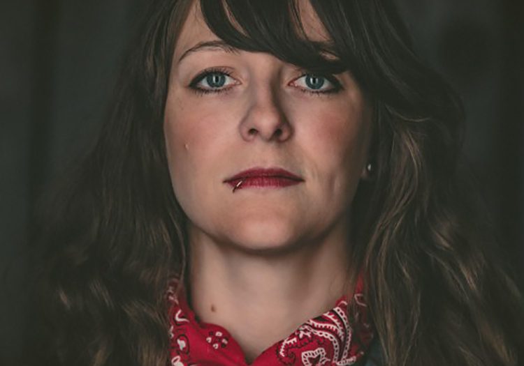Woman with red bandana and dark hair.
