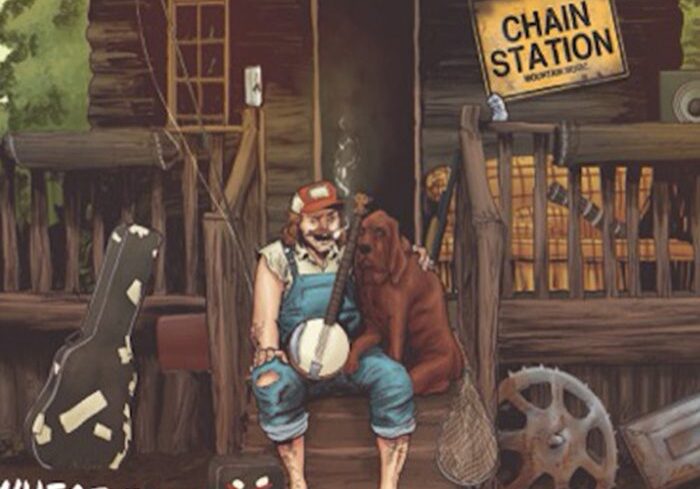 Man with banjo and dog on porch.
