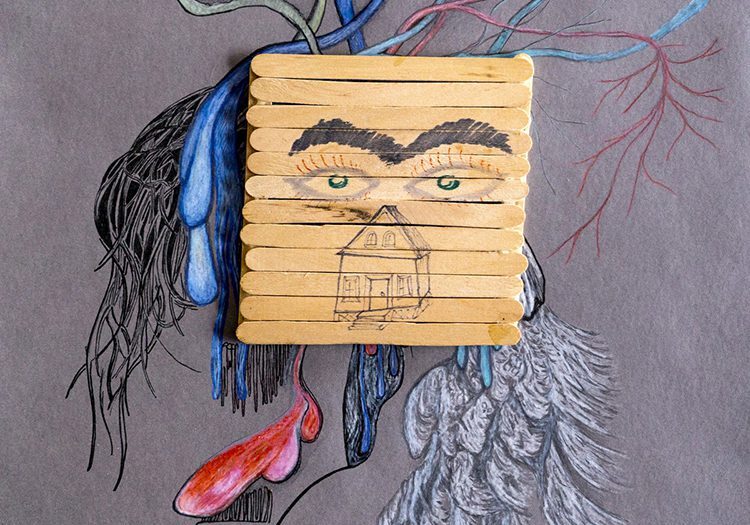 Abstract face with popsicle stick mask.