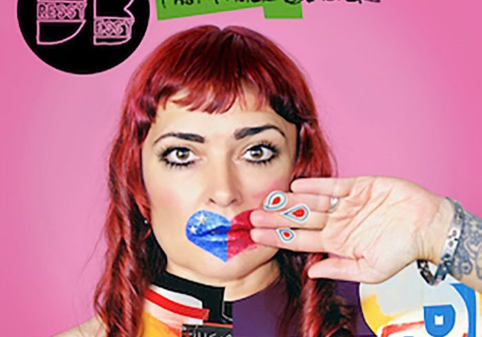 Woman holding a heart, colorful background.