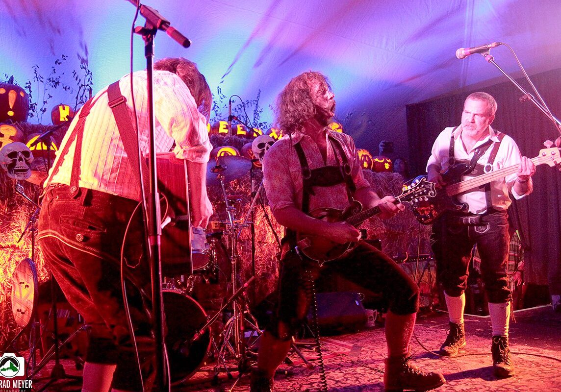 Band performing in Halloween-themed setting.