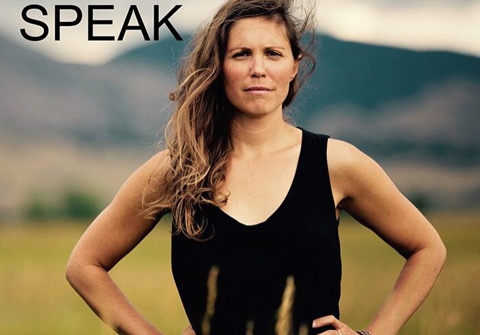 Woman standing in a field, album cover.