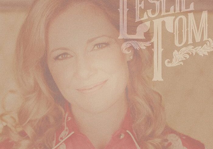 Woman smiling with "Leslie Tom" text overlay.