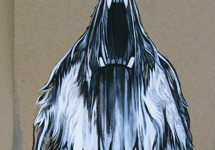 Illustration of a howling wolf on paper.
