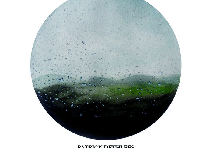 Rainy landscape through a circular lens.