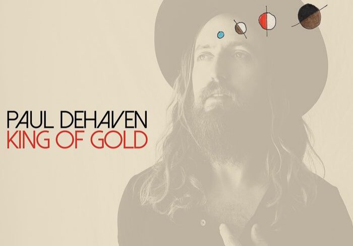 Man with hat, cosmic symbols, album cover.