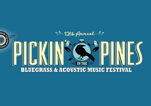 Pickin' in the Pines music festival banner.