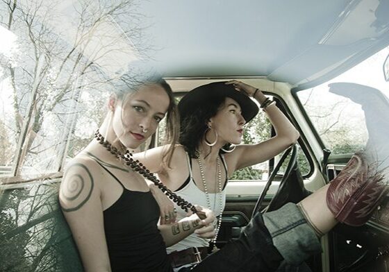 Two women sitting in a car.