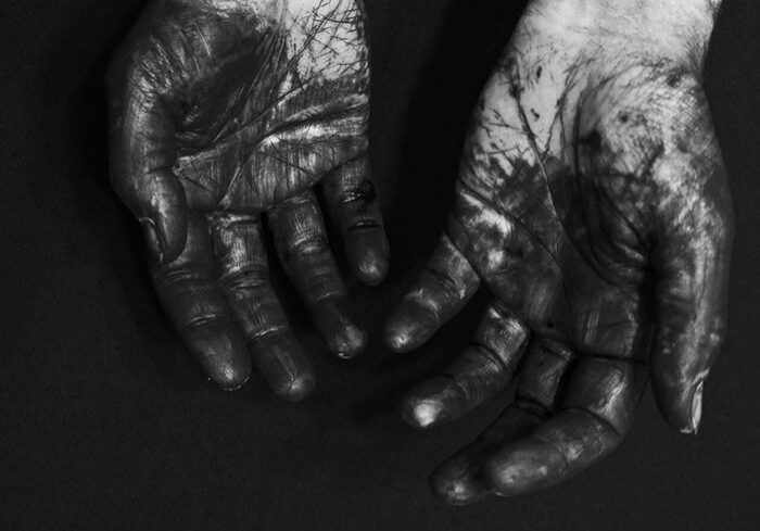 Dirty hands with black and white contrast.