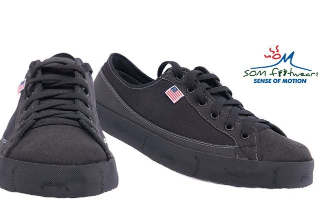 Black casual shoes with American flag logo.