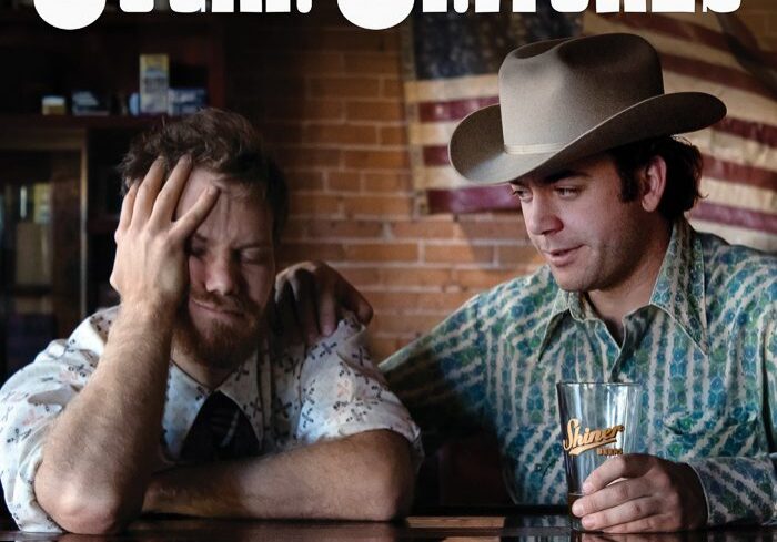 Two men sitting at a bar counter.