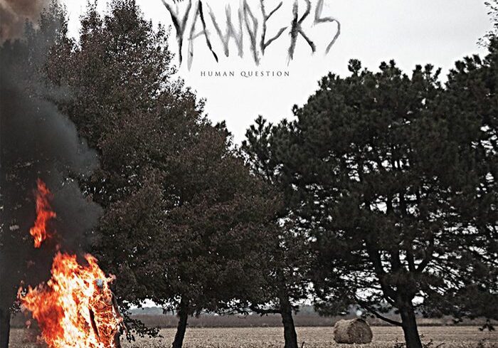 Fire burning in a rural landscape setting.
