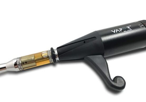 Black vaporizer with a cartridge attached.