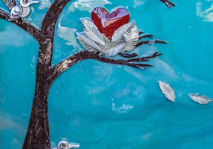 Tree with birds and heart-shaped nest.