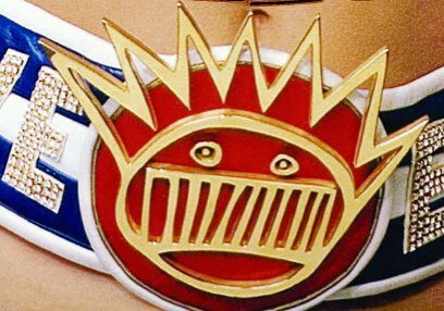 Person wearing Ween-themed belt with emblem.
