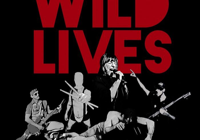 Band performing with "Wild Lives" text.